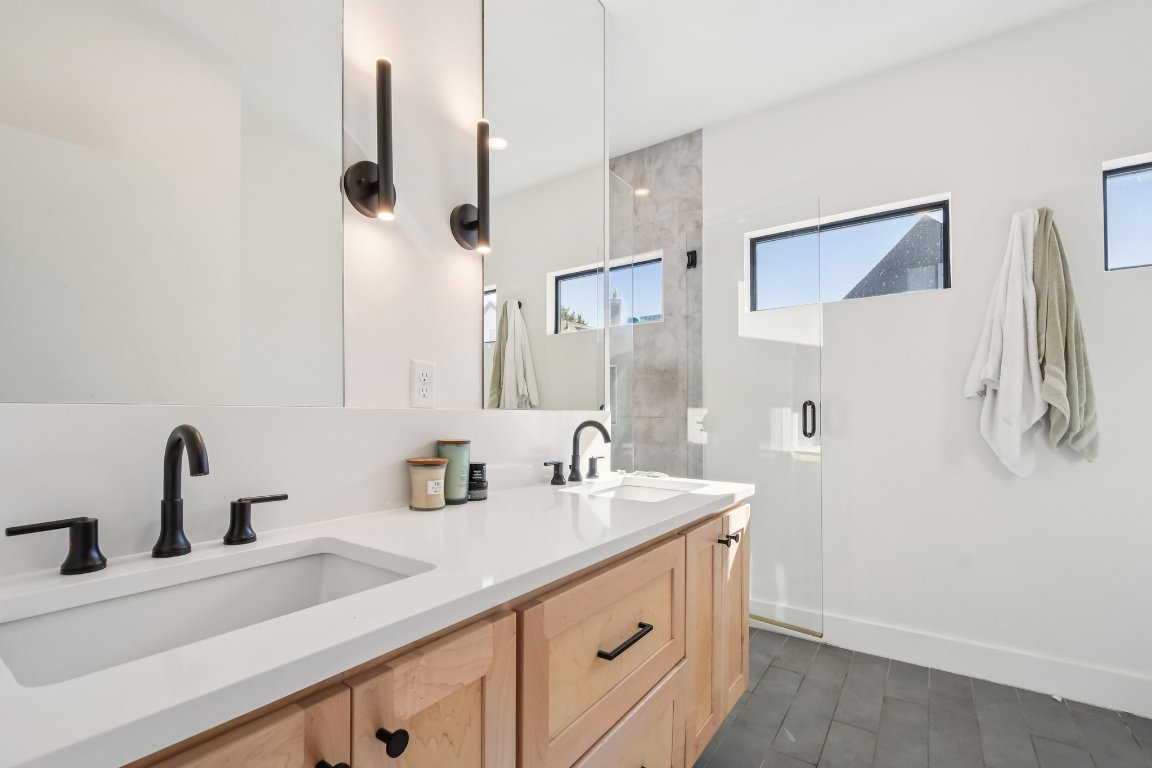 2916 East 13th Street, Unit 2 Austin, TX 78702 - Photo 14 of 35 Full bath with double vanity and an enclosed shower