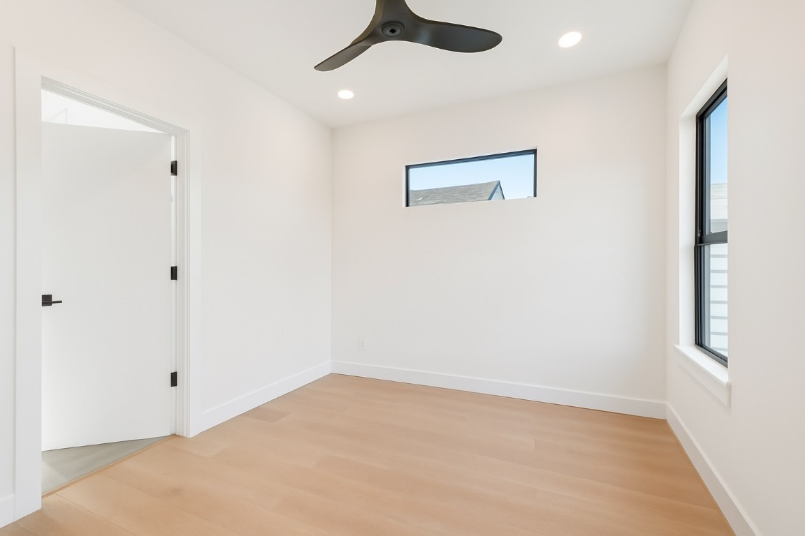 2916 East 13th Street, Unit 2 Austin, TX 78702 - Photo 18 of 35 Spare room featuring light wood-style floors, recessed lighting, and ceiling fan