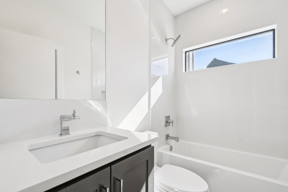 2916 East 13th Street, Unit 2 Austin, TX 78702 - Photo 20 of 35 Bathroom with vanity and shower / bath combination