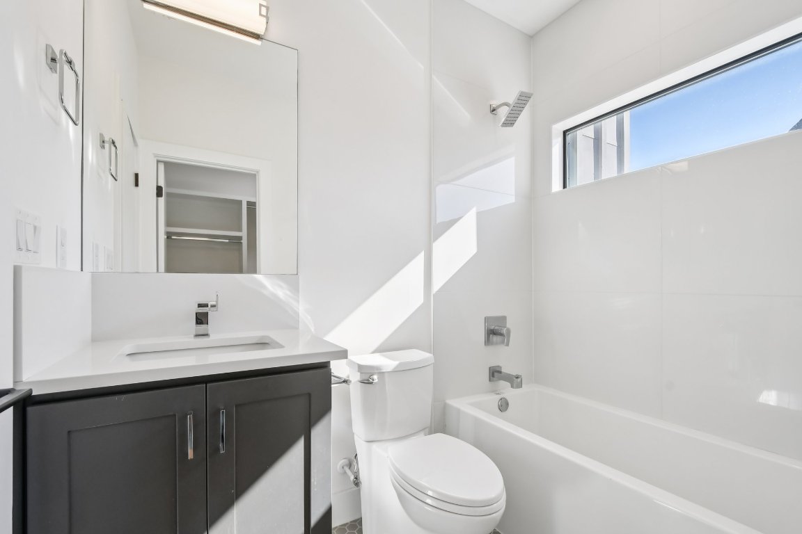 2916 East 13th Street, Unit 2 Austin, TX 78702 - Photo 24 of 35 Full bath featuring vanity and tub / shower combination