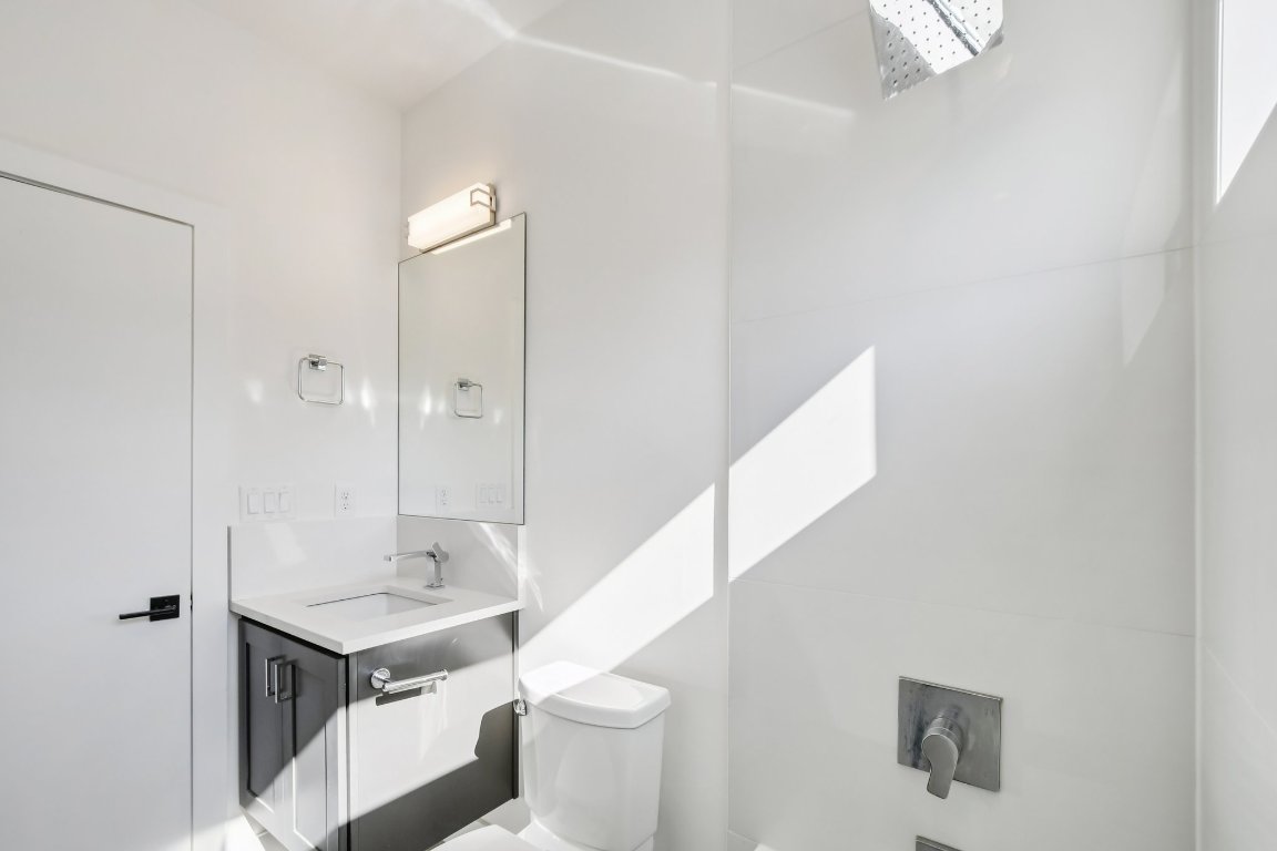 2916 East 13th Street, Unit 2 Austin, TX 78702 - Photo 25 of 35 Half bathroom featuring vanity and toilet