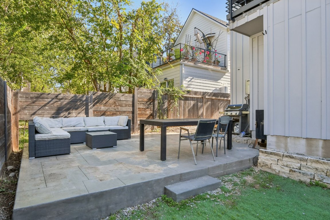 2916 East 13th Street, Unit 2 Austin, TX 78702 - Photo 26 of 35 Fenced backyard with a patio, a grill, and an outdoor living space
