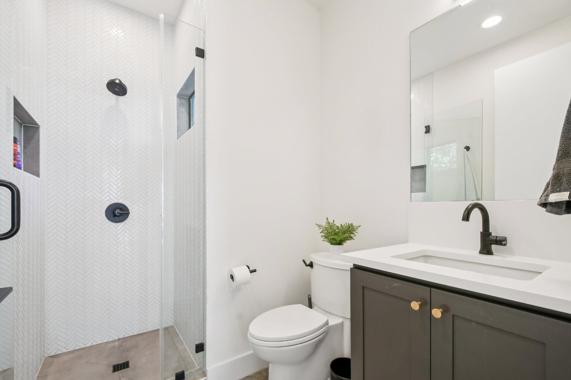 2916 East 13th Street, Unit 2 Austin, TX 78702 - Photo 27 of 35 Full bathroom featuring walk in shower, vanity, and recessed lighting