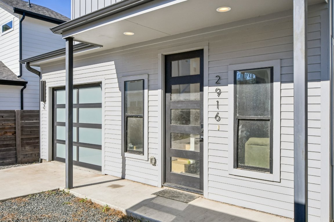 2916 East 13th Street, Unit 2 Austin, TX 78702 - Photo 4 of 35 View of exterior entry with a garage