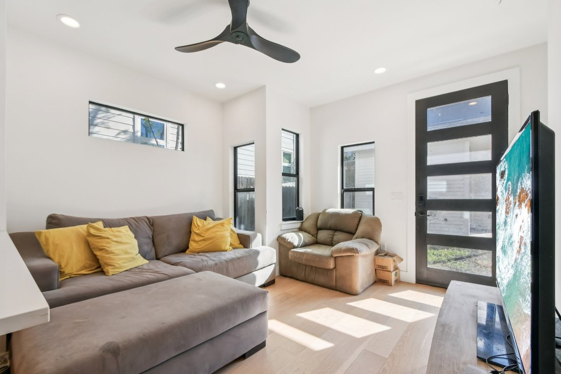 2916 East 13th Street, Unit 2 Austin, TX 78702 - Photo 5 of 35 Living area with recessed lighting, a ceiling fan, and wood finished floors
