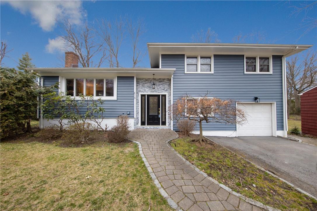 418 Stratton Road New Rochelle, NY 10804 - Photo 1 of 1 a front view of a house with a yard and garage