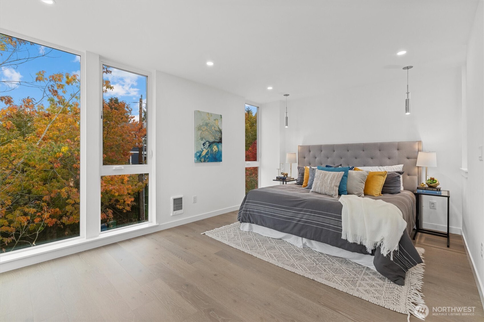 2009 South Norman Street, Unit B Seattle, WA 98144 - Photo 12 of 27 a spacious bedroom with a large bed and a window