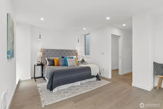 a bedroom with a bed and a couch