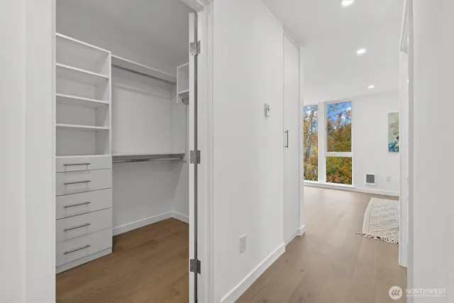 a view of closet area with empty racks