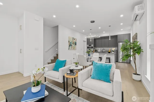 a living room with furniture and a potted plant