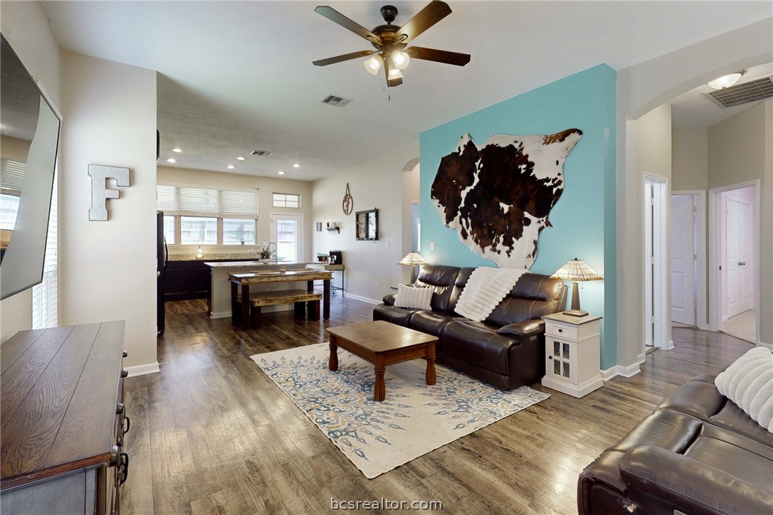 2071 Positano Loop Bryan, TX 77808 - Photo 6 of 31 a living room with furniture and wooden floor