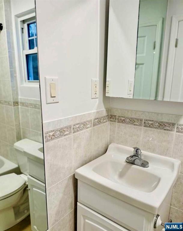 61 Hille Place, Unit 2 Ridgefield Park, NJ 07660 - Photo 7 of 19 a bathroom with a sink and a mirror