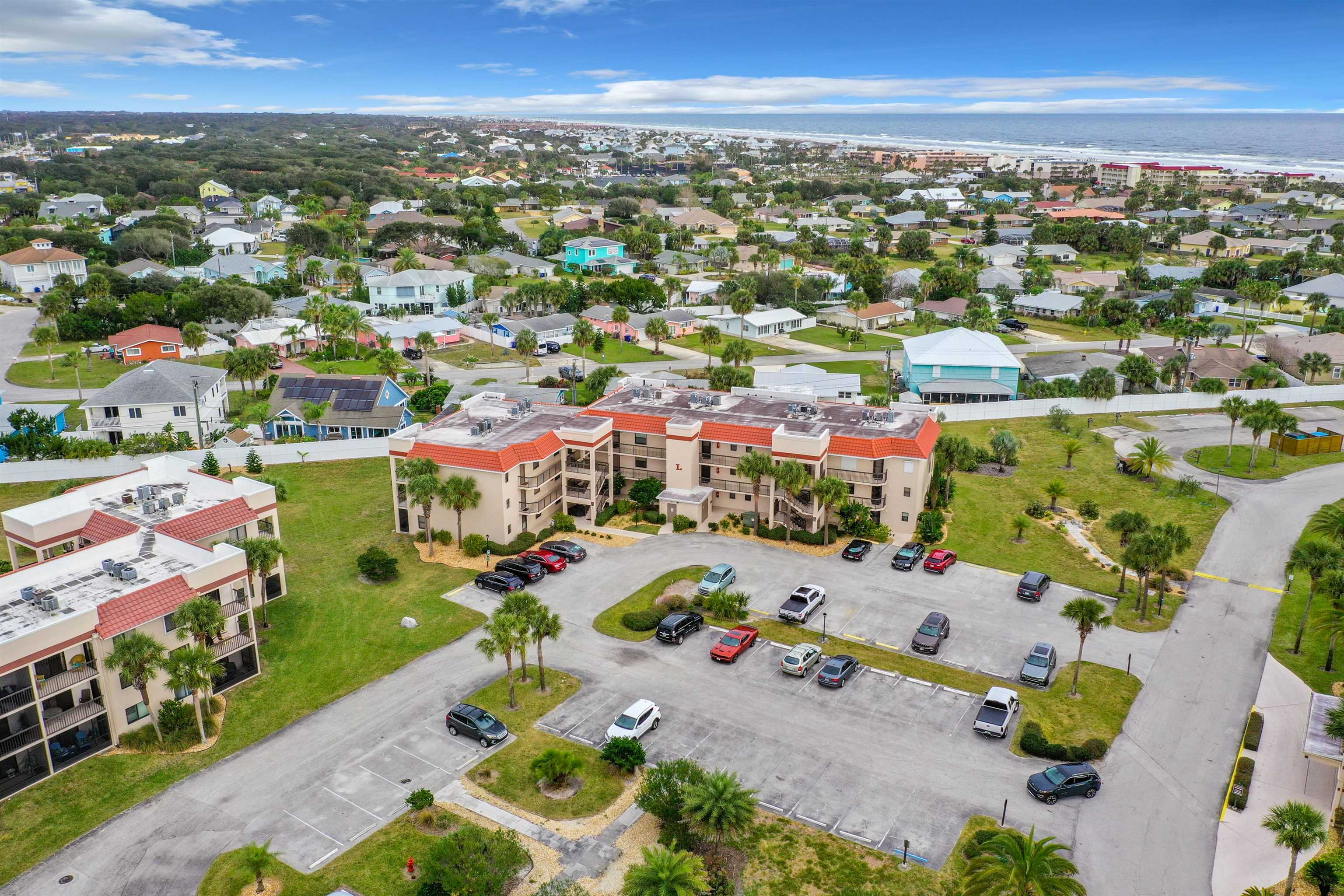 4250 A1a South Unit L-26 (elevator Bldg) St. Augustine, FL 32080 - Photo 34 of 38 an aerial view of a city with lots of residential buildings ocean and mountain view in back
