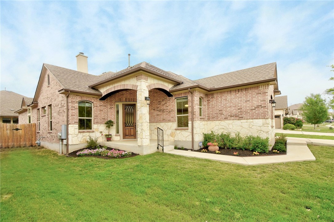 2313 Molly Lane Leander, TX 78641 - Photo 1 of 1 a front view of a house with a yard