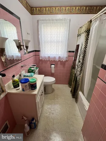 a view of living room with furniture and a window