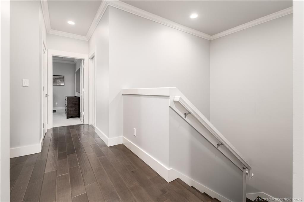411 Southeast High School Avenue Stuart, FL 34994 - Photo 19 of 37 a view of a hallway with wooden floor