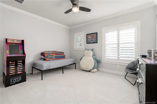 a bedroom with furniture and a window