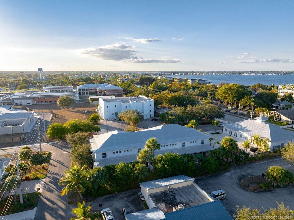411 Southeast High School Avenue Stuart, FL 34994 - Photo 2 of 37 an aerial view of a house with a garden