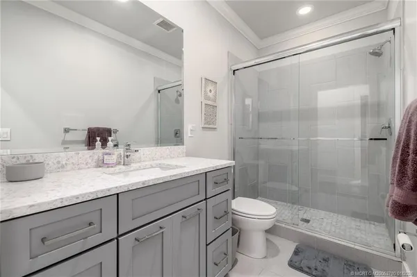 a view of bathroom with a sink and washer dryer