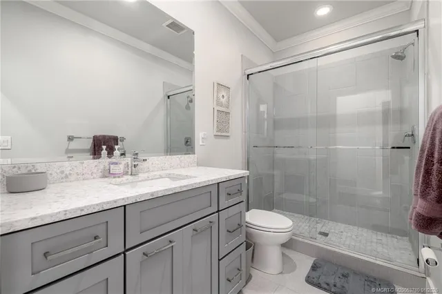 a view of bathroom with a sink and washer dryer