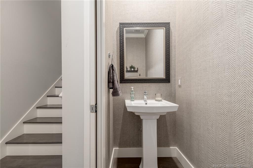 411 Southeast High School Avenue Stuart, FL 34994 - Photo 25 of 37 a bathroom with a sink and a mirror