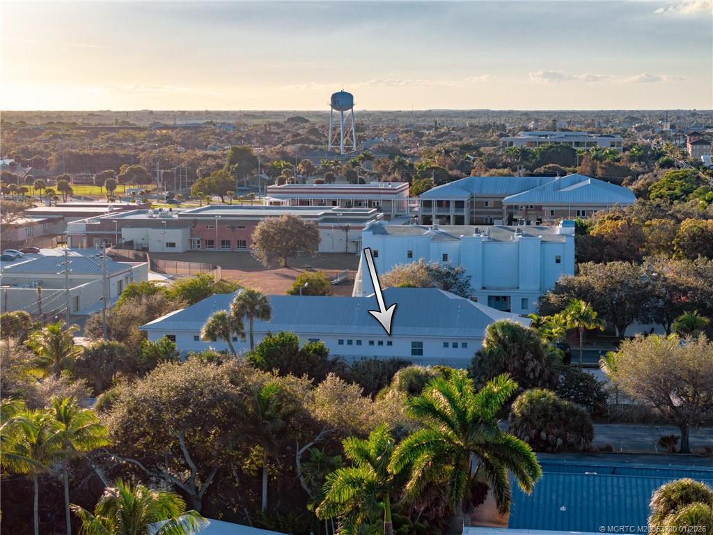 411 Southeast High School Avenue Stuart, FL 34994 - Photo 34 of 37 an aerial view of a house with a garden