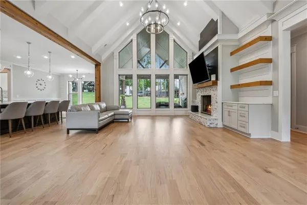 a living room with furniture flat screen tv and a fireplace