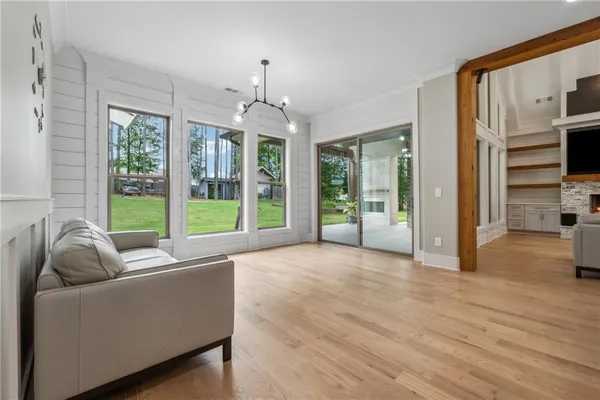 a view of a living room kitchen and a floor to ceiling window