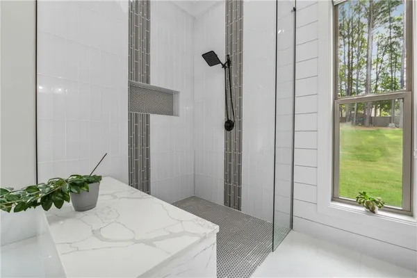 a view of a livingroom with furniture and a window