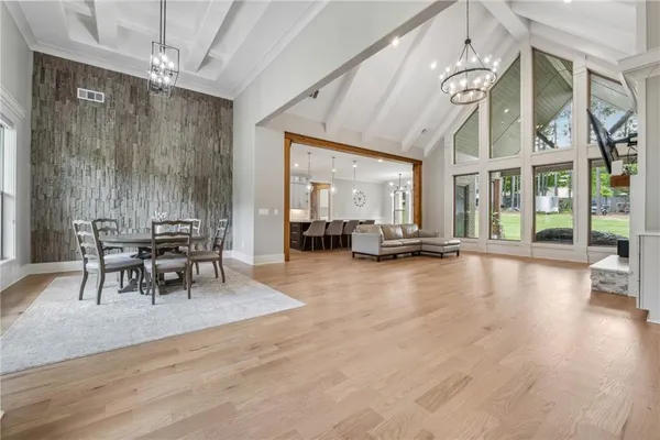 a dining room with furniture and window