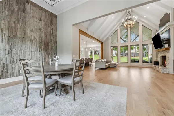 a view of a livingroom with furniture and a floor to ceiling window