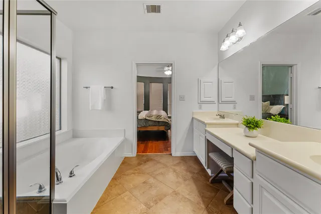 a bathroom with a shower and a bathtub