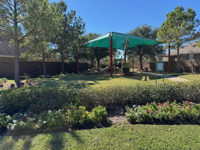 a view of a house with backyard porch and sitting area