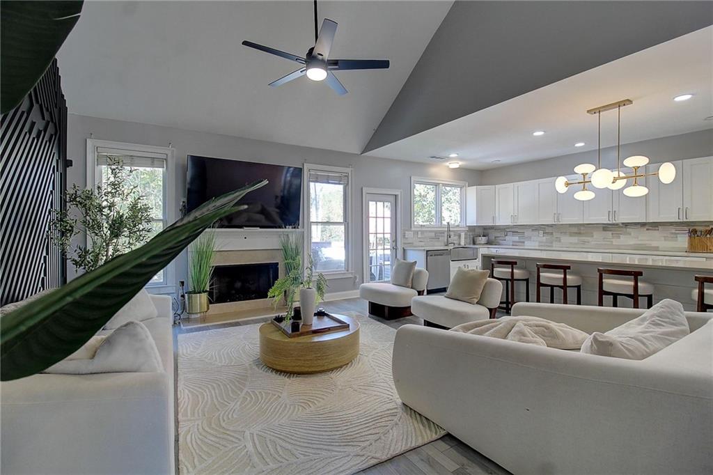 3064 Montclair Circle Southeast Smyrna, GA 30080 - Photo 14 of 48 a living room with furniture and a chandelier