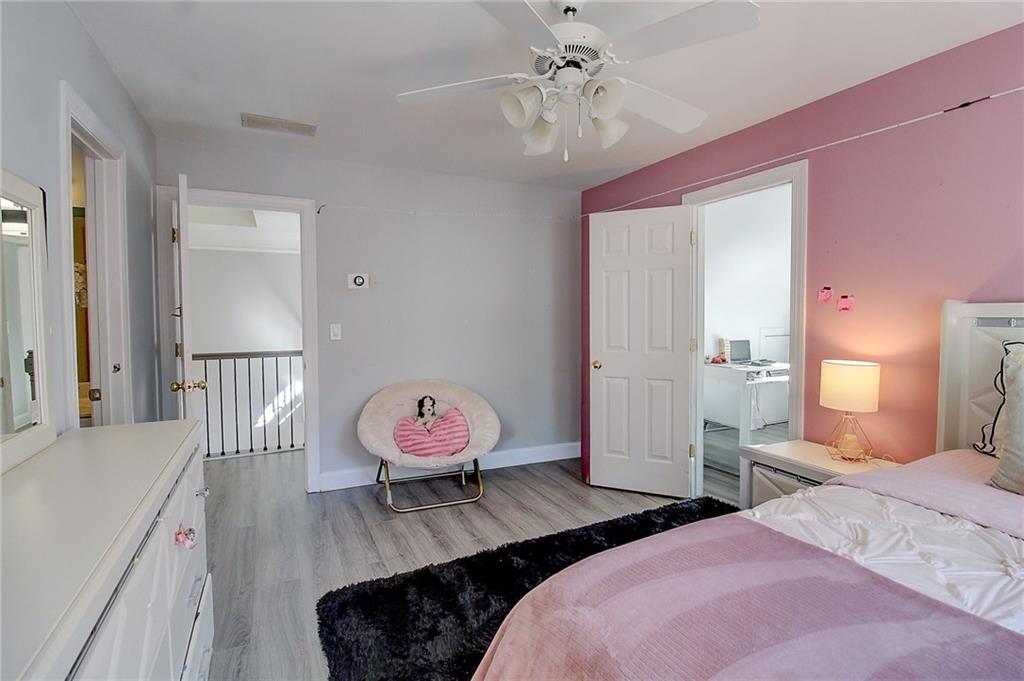 3064 Montclair Circle Southeast Smyrna, GA 30080 - Photo 28 of 48 a bedroom with bed and wooden floor