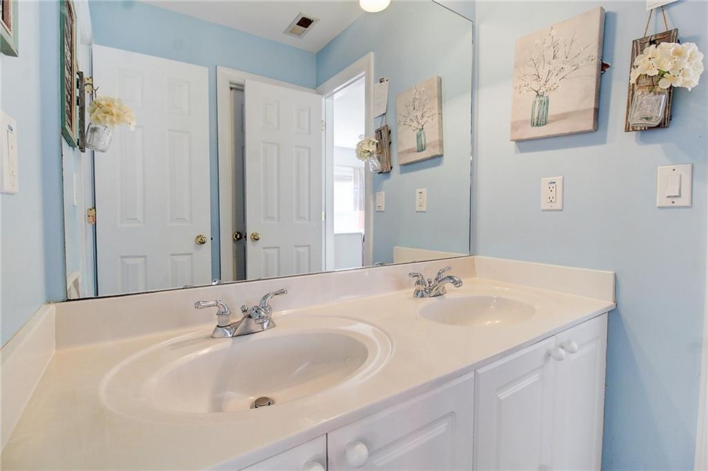 3064 Montclair Circle Southeast Smyrna, GA 30080 - Photo 30 of 48 a bathroom with a sink and a mirror