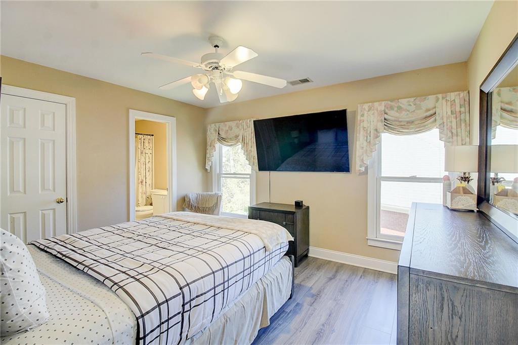 3064 Montclair Circle Southeast Smyrna, GA 30080 - Photo 32 of 48 a bedroom with a bed and a flat screen tv