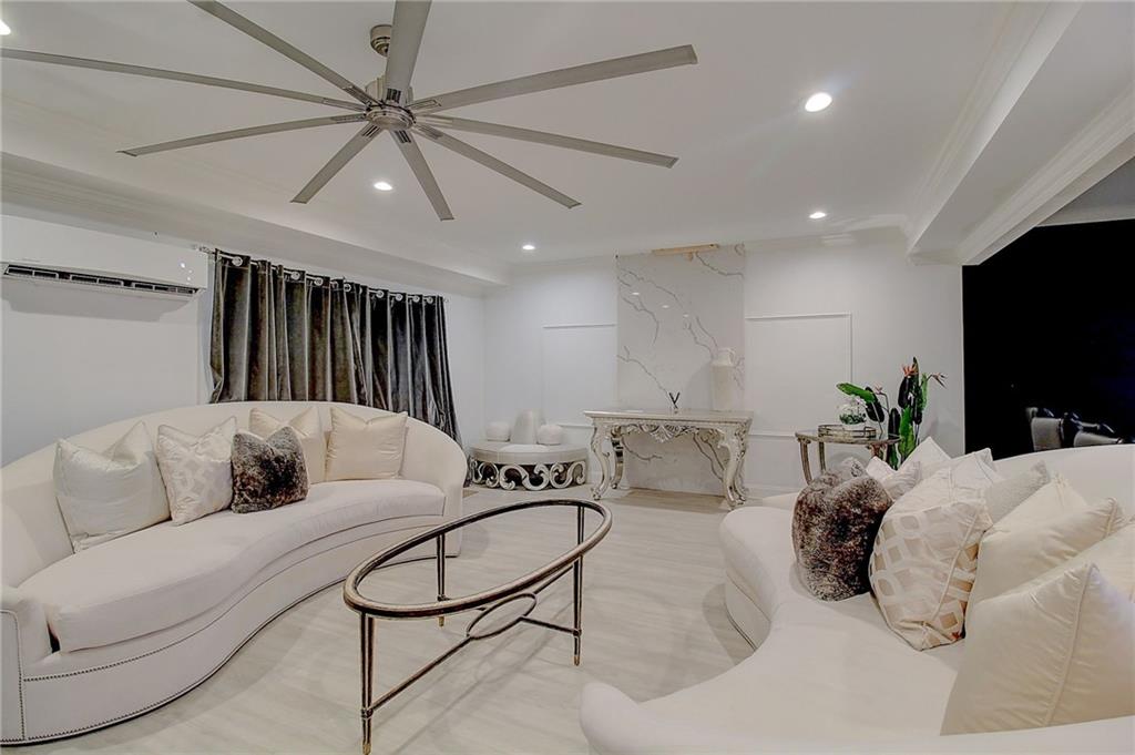 3064 Montclair Circle Southeast Smyrna, GA 30080 - Photo 37 of 48 a living room with furniture and a flat screen tv