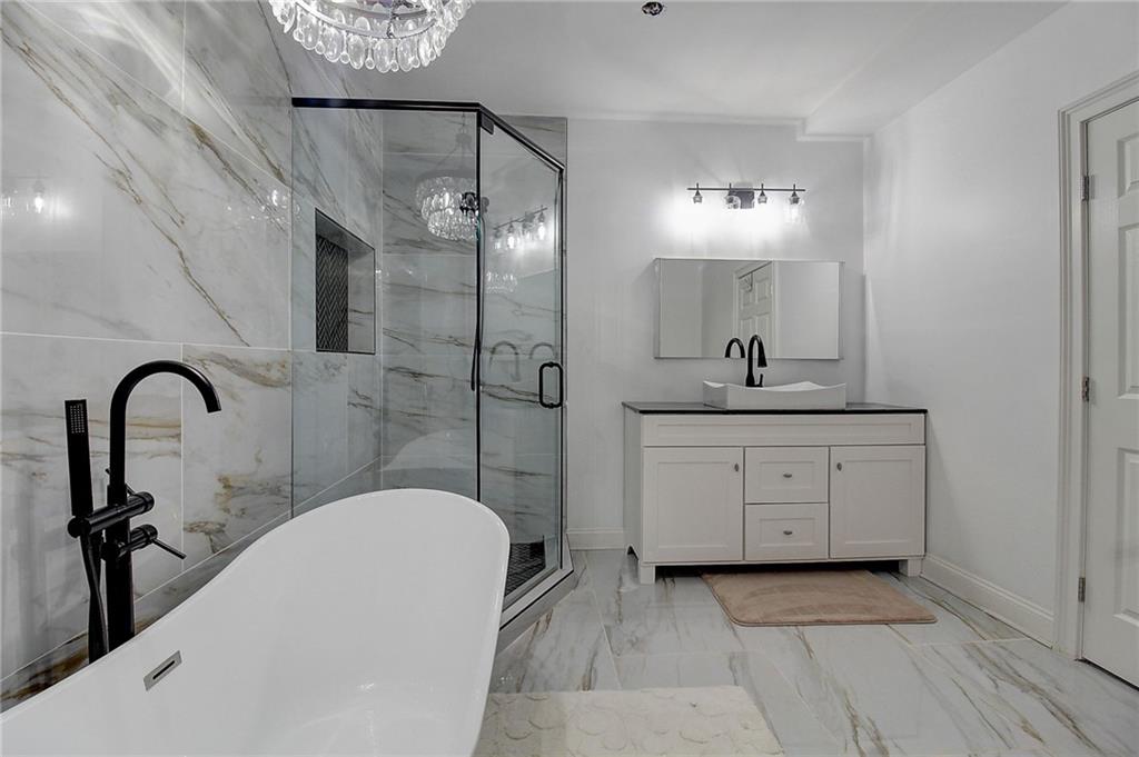 3064 Montclair Circle Southeast Smyrna, GA 30080 - Photo 41 of 48 a bathroom with a sink a toilet and a mirror