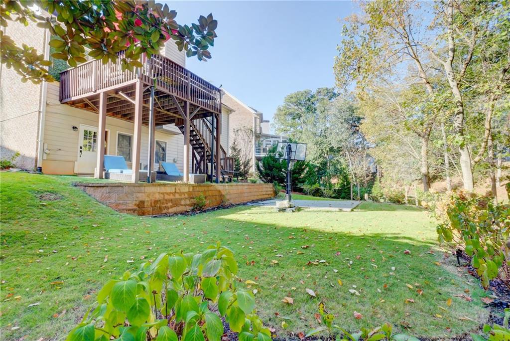 3064 Montclair Circle Southeast Smyrna, GA 30080 - Photo 44 of 48 a view of white house with a big yard and large trees