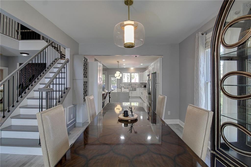 3064 Montclair Circle Southeast Smyrna, GA 30080 - Photo 5 of 48 a hallway with chandelier and wooden floor