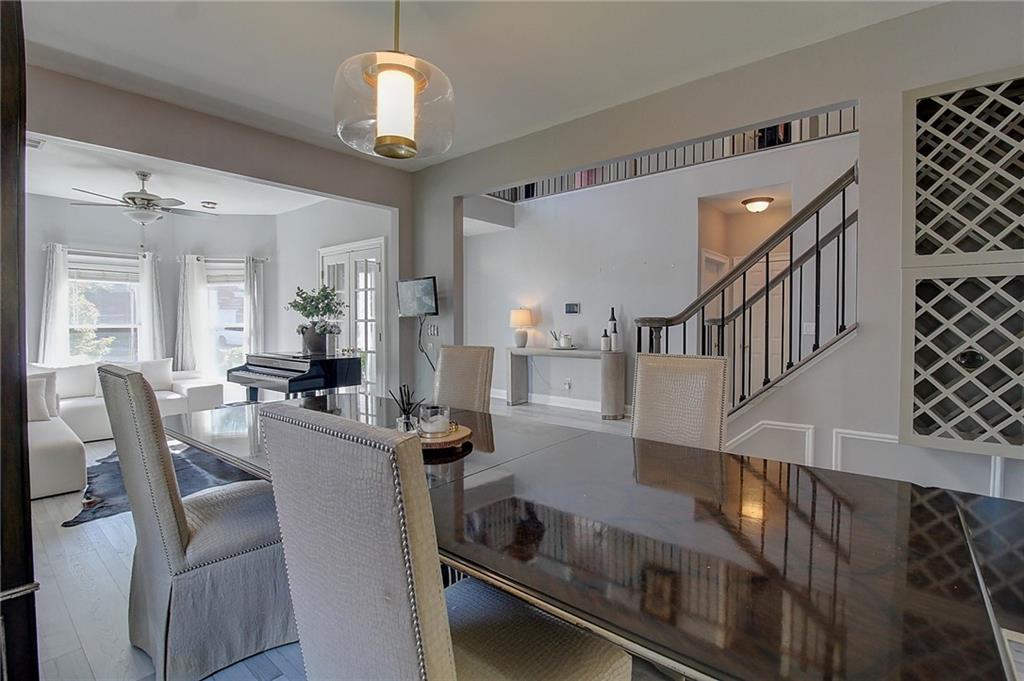 3064 Montclair Circle Southeast Smyrna, GA 30080 - Photo 6 of 48 a view of dining room and livingroom with furniture wooden floor a chandelier