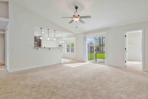 a view of a kitchen with a sink and a window