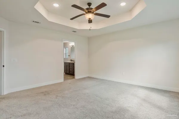 an empty room with a ceiling fan and a ceiling fan