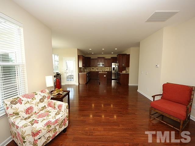 2727 Follow Me Way Raleigh, NC 27610 - Photo 13 of 18 a living room with furniture and kitchen view