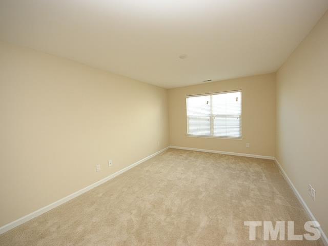 2727 Follow Me Way Raleigh, NC 27610 - Photo 18 of 18 an empty room with a window