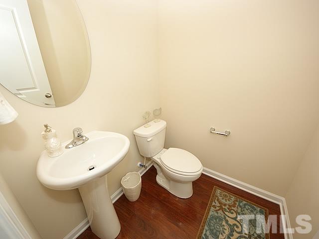 2727 Follow Me Way Raleigh, NC 27610 - Photo 6 of 18 a bathroom with a sink and a mirror