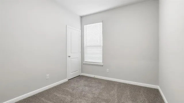 a view of storage and utility room with wooden floor