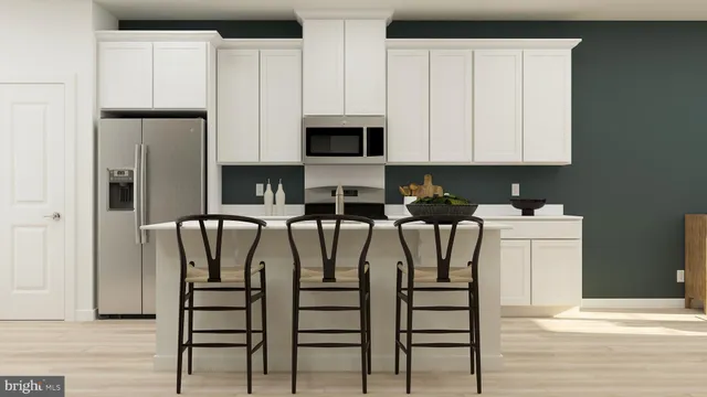 a view of cabinets and chairs with wooden floor