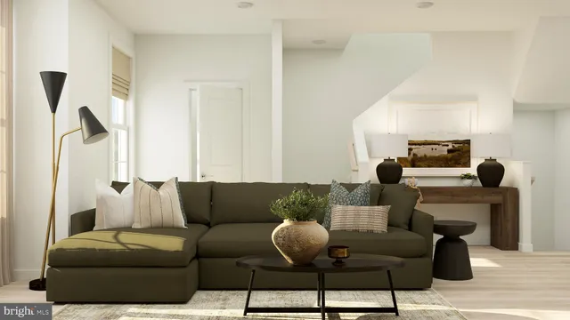 a living room with furniture and a lamp